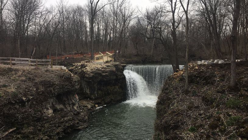 Work is nearing completion on a bridge and overlook deck that will allow visitors to get closer to the rushing waters of Cedar Cliff Falls. The project is the last piece of an overall plan to improve the Indian Mound Reserve park in Greene County. RICHARD WILSON/STAFF