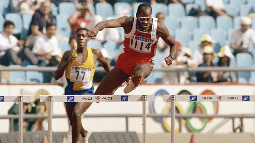 FILE - In this Sept. 23, 1988, file photo, Edwin Moses of the United States, right, pulls ahead of Allan Ince of Barbados during heat competition in the men's 400 meter hurdles at the Olympics in Seoul, Korea. (AP Photo/Lennox McLendon, File)