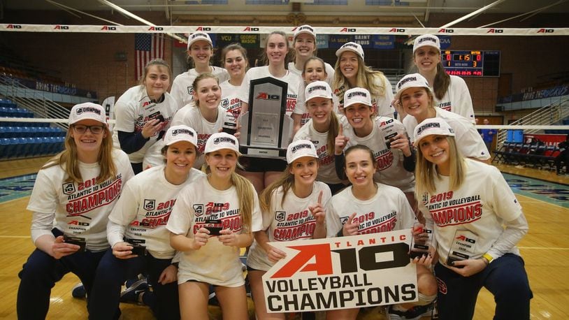 The Dayton volleyball team poses for a photo after winning the Atlantic 10 championship in 2019. Photo courtesy of UD and A-10