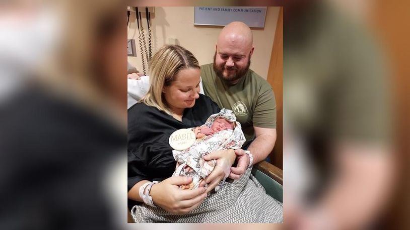 Kirstyn and Brad Stapleton hold their daughter, Mabel Mae. Mabel arrived into the new year after 2 a.m. Monday morning. CONTRIBUTED