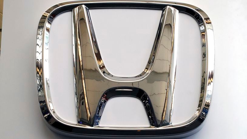 FILE- This Feb. 14, 2019 file photo shows a Honda logo at the 2019 Pittsburgh International Auto Show in Pittsburgh. Honda has plans to sell two all-electric SUVs in the U.S. for the 2024 model year, and it soon will offer hybrid gas-electric versions of its top-selling models. The announcements March 11 come as the automaker acknowledges it has work to do to comply with emissions-reduction targets that will be coming from the Biden administration, and a California ban on sales of new internal-combustion vehicles by 2035. (AP Photo/Gene J. Puskar, File)