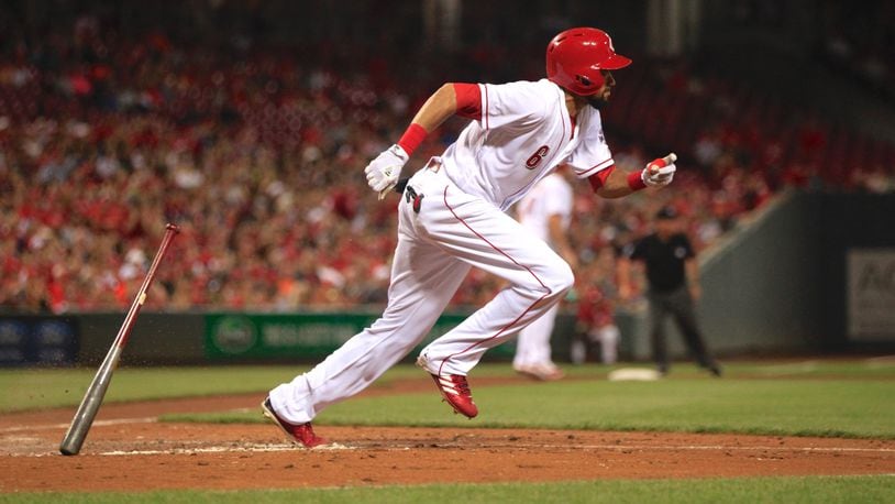 The Reds’ Billy Hamilton drives in a run with a sacrifice fly against the Marlins on Friday, July 21, 2017, at Great American Ball Park in Cincinnati. David Jablonski/Staff