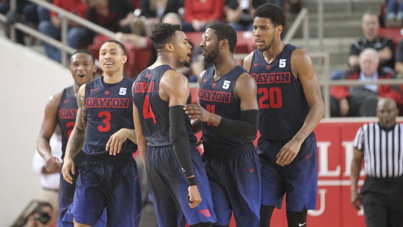 Dayton seniors (left to right) Kendall Pollard, Kyle Davis, Charles Cooke, Scoochie Smith and sophomore Xeyrius Williams, far right, react after the third 3-pointer by Smith in overtime against Davidson on Friday, Feb. 24, 2017, at Belk Arena in Davidson, N.C.
