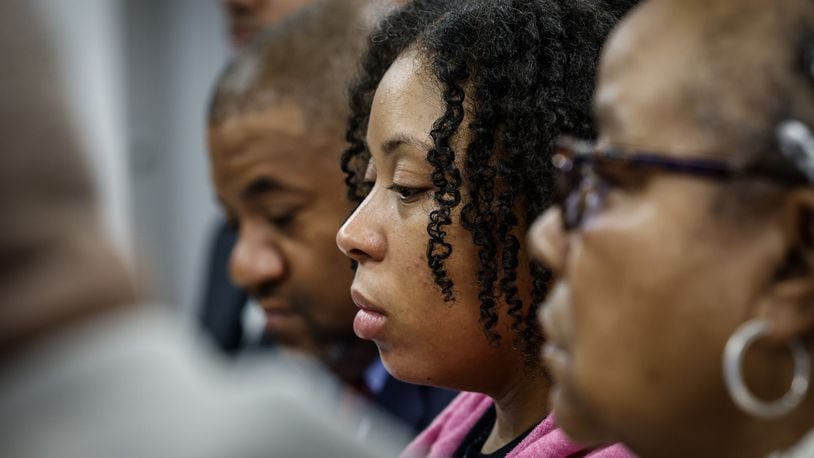 Michelle Cooper, right and Brittney Cooper, center, meet with the press Wednesday December 7, 2022 at Wright and Schulte law office in Dayton. The Coopers filed a lawsuit accusing Lyft of failing to protect Brandon Cooper after he was gunned down during a robbery earlier this year. Brittney was Brandon's wife and Michelle was Brandon's mother. JIM NOELKER/STAFF