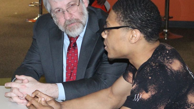 State Superintendent of Public Instruction Paolo DeMaria (left), shown in Springfield, said new report cards released Thursday show improvement across the state. JEFF GUERINI/STAFF