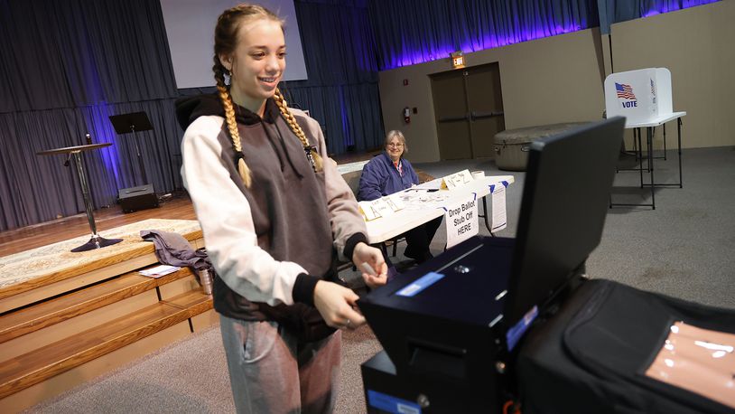 Alanna Lubbers smiles as the voting machine takes her ballot Tuesday, Nov. 8, 2022 at the Trinity Missionary Church. It was Alanna's first time voting. BILL LACKEY/STAFF