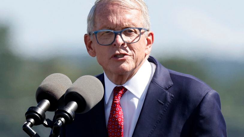 FILE— In this file photo from Sept. 9, 2022 Ohio Gov. Mike DeWine speaks during the groundbreaking ceremony for the new Intel semiconductor manufacturing facility in New Albany, Ohio. The Ohio Debate Commission said Wednesday, Sept. 21, 2022, that neither Republican Gov. DeWine nor Senate nominee JD Vance accepted their invitations that were extended in May by the 5 p.m. Tuesday deadline. (AP Photo/Paul Vernon, File)