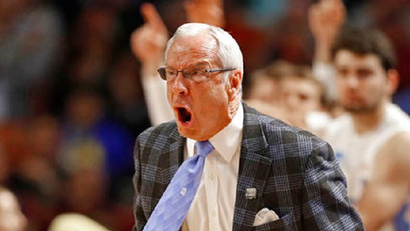 North Carolina head coach Roy Williams shouts at his team during the first half in a second-round game against Arkansas of the NCAA men's college basketball tournament in Greenville, S.C., Sunday, March 19, 2017. (AP Photo/Chuck Burton)