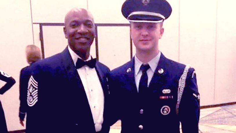 Airman 1st Class Gage Schneck poses for a photo with Chief Master Sergeant of the Air Force Kaleth O. Wright during a Joint Base San Antonio Honor Guard event. Schneck served as a ceremonial guardsman from July 1, 2019, to Jan. 15, 2020. (Courtesy photo)