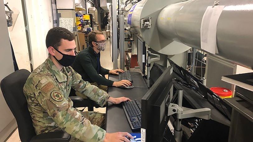 1st Lt. Tyler Despard (front) and Kameron Hayes monitor testing on the supersonic rain erosion test rig. COURTESY PHOTO/GREG LANCHMAN