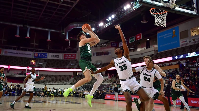 Wright State's Grant Basile shoots over Cleveland State's Deante Johnson (35) and Torrey Patton during Monday night's Horizon League semifinal at Indiana Farmers Coliseum. Joe Craven/Wright State Athletics