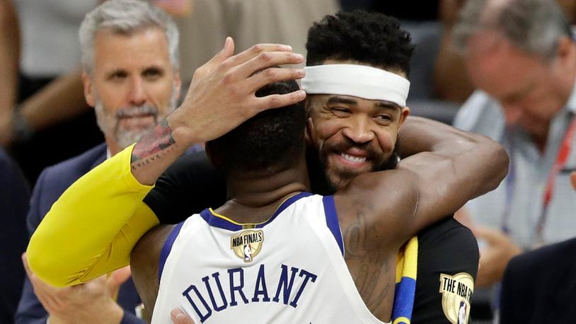 Golden State Warriors' Kevin Durant and JaVale McGee celebrate following Game 4 of basketball's NBA Finals against the Cleveland Cavaliers, Friday, June 8, 2018, in Cleveland. The Warriors defeated the Cavaliers 108-85.