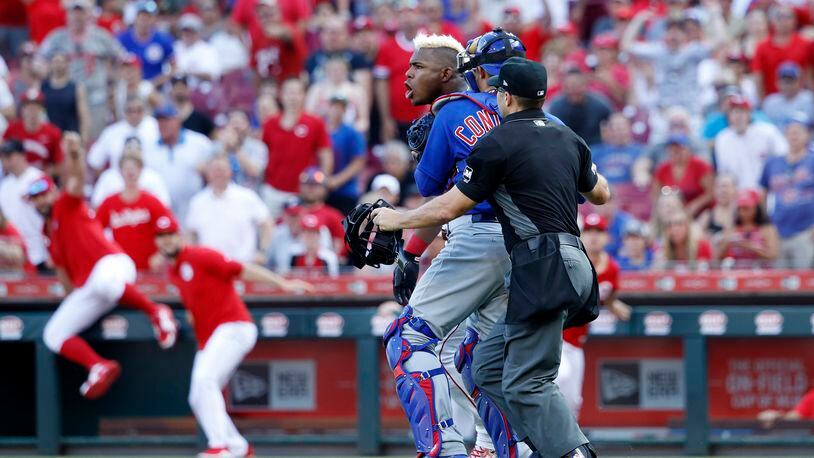 CINCINNATI, OH - JUNE 29: Yasiel Puig #66 of the Cincinnati Reds is restrained after being hit by a pitch from Pedro Strop #46 of the Chicago Cubs in the eighth inning at Great American Ball Park on June 29, 2019 in Cincinnati, Ohio. The Cubs won 6-0. (Photo by Joe Robbins/Getty Images)
