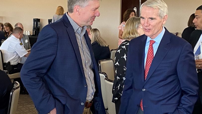 AES Ohio Vice President Tom Raga (left) talks with U.S. Sen. Rob Portman, R-OH (right) prior to Portman addressing the Dayton Area Chamber of Commerce’s Government Affairs Breakfast at NCR Country Club in Kettering Friday, July 15, 2022. During the event, Portman detailed his legislative priorities in Congress. ERIC SCHWARTZBERG/STAFF