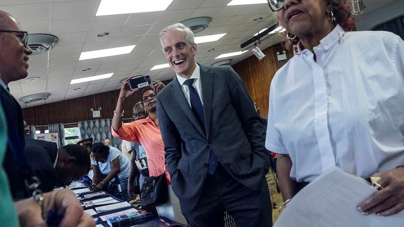 Veterans Affairs Secretary Denis McDonough, center, meets with attendees at a resource fair for veterans and survivors to apply for benefits under the PACT Act, Wednesday Aug. 2, 2023, in New York. Last year Congress delivered the Pact Act to expand VA healthcare and benefits for more than five million veterans and their families. (AP Photo/Bebeto Matthews)