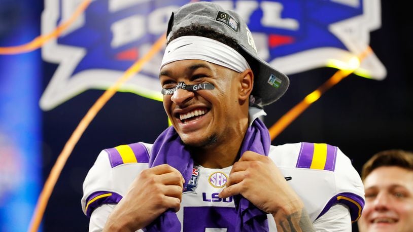 LSU safety Grant Delpit celebrates on the podium after winning the Chick-fil-A Peach Bowl 28-63 over the Oklahoma Sooners at Mercedes-Benz Stadium on December 28, 2019 in Atlanta, Georgia. (Photo by Kevin C. Cox/Getty Images)