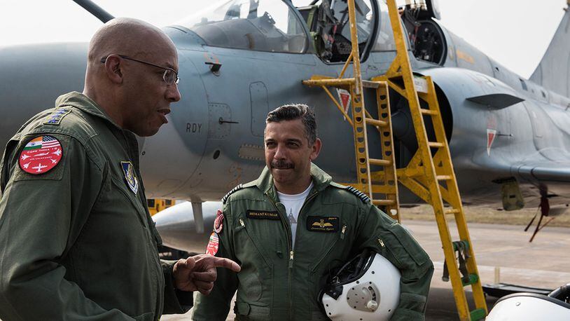 Gen. CQ Brown Jr., Pacific Air Forces commander, discusses his orientation flight in an Indian Air Force Mirage 2000 at Cope India 19 at Kalaikunda Air Force Station, India, Dec. 14. Total participation in the exercise included more than 200 U.S. Airmen, F-15 Eagles from the 18th Wing, Kadena Air Base, Japan, and C-130J Super Hercules from 182nd Airlift Wing, Illinois Air National Guard, alongside IAF airmen operating Sukhoi 30s, Jaguars, Mirage 2000s, C-130Js, as well as Airborne Early Warning and Control System and refueling aircraft. (U.S. Air Force photo/Staff Sgt. Hailey Haux)