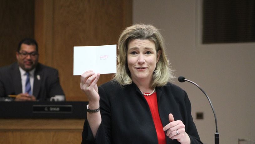Dayton Mayor Nan Whaley holds up Valentine’s Day card at State of City address this morning. CORNELIUS FROLIK / STAFF