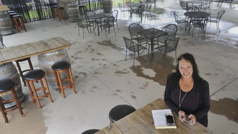 Heather Sukola, owner of Heather’s Coffee & Cafe’ in Springboro, lost half of her seating to comply with the Governor opening outside service for restaurants and bars. MARSHALL GORBYSTAFF