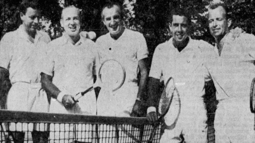 Nick Bollettieri, second from right, poses for a photo at Urbana Country Club in August 1959 with (left to right): Urbana Country Club pro Fred Norcross; Jack March, the director of the World Tennis Championships in Cleveland; former world amateur champion Fred Perry; and, far right, California professional champion Bob Rodgers. Springfield News-Sun photo