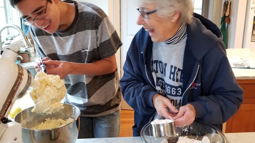 Nathan Hess baking with his grandmother, Sylvia Hess.