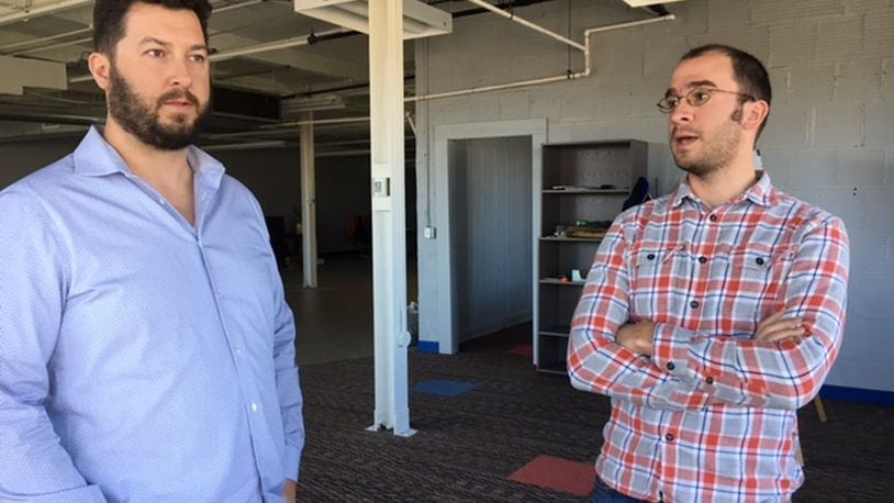 Mile Two LLC partners Jeff Graley, left, and Jorge Sanchez are at home in downtown Dayton’s newly named “Innovation District,” off East Second Street near the Tech Town business park. THOMAS GNAU/STAFF