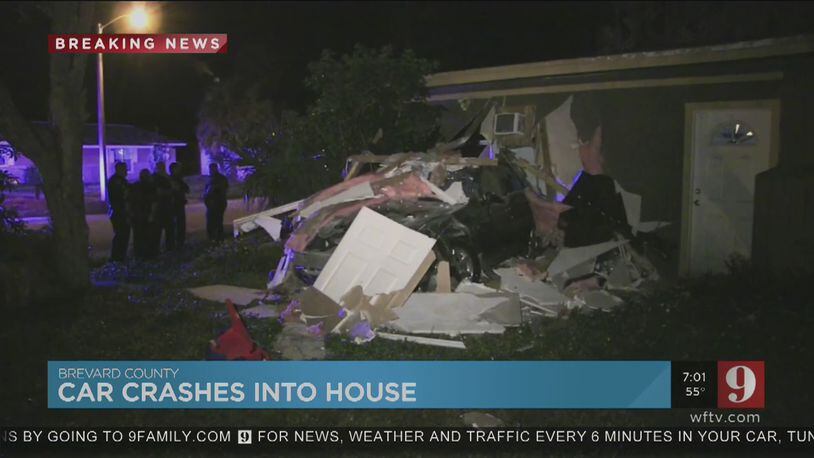 The wreckage is seen after a Florida man allegedly plowed through a bedroom with three children inside early Saturday, the Florida Highway Patrol said.