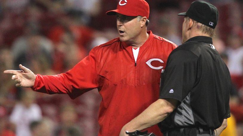 Reds manager Bryan Price argues with an umpire following the ejection of reliever Ross Ohlendorf on May 11, 2016, at Great American Ball Park in Cincinnati. David Jablonski/Staff