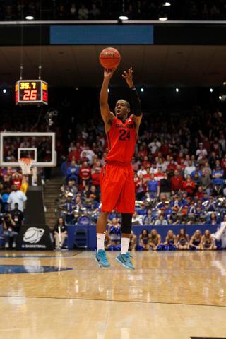 Dayton guard Jordan Sibert hits the game-winning 3-pointer with 35 seconds left against Boise State in the First Four on Wednesday, March 18, 2015, at UD Arena. David Jablonski/Staff