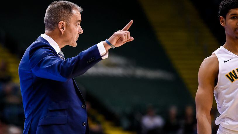 Wright State University head men’s basketball coach Scott Nagy signals to his team from the sideline during their game against Miami University Tuesday, Nov. 15 at the Nutter Center at Wright State University in Fairborn. NICK GRAHAM/STAFF
