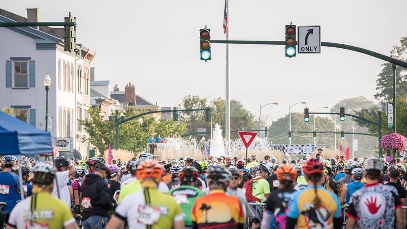 Participants in the 2017 Tour de Donut fill the Troy Public Square during the event’s first year in Troy. The bicycle event previously was held in Darke County. Contributed photo.