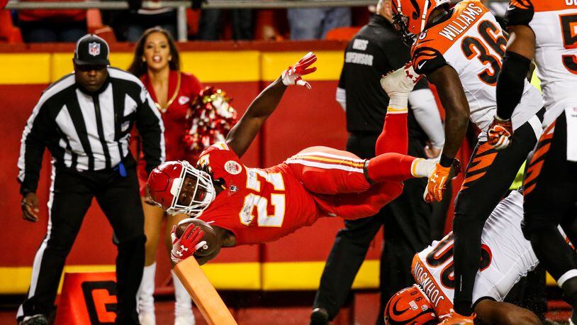KANSAS CITY, MO - OCTOBER 21: Kareem Hunt #27 of the Kansas City Chiefs dives across the goal line for the second touchdown of the game during the second quarter of the game against the Cincinnati Bengals at Arrowhead Stadium on October 21, 2018 in Kansas City, Kansas. (Photo by David Eulitt/Getty Images)