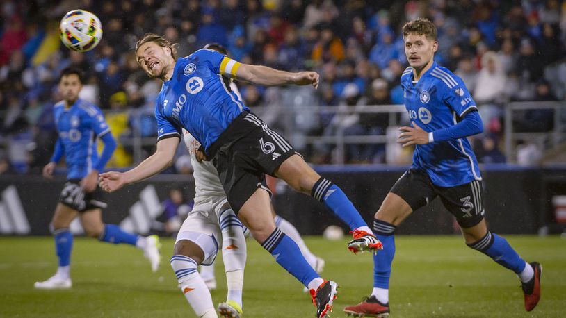 CF Montreal's Samuel Piette (6) heads the ball against FC Cincinnati during the first half of an MLS soccer match Saturday, April 13, 2024, in Montreal. (Peter McCabe/The Canadian Press via AP)