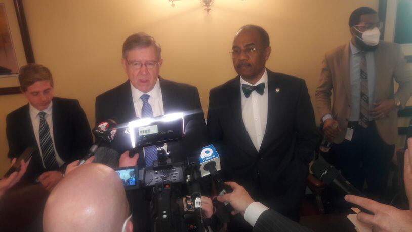 House Speaker Bob Cupp, R-Lima (center left) and state Sen. Vernon Sykes, D-Akron (center right) talk to reporters after the Ohio Redistricting Commission meeting Feb. 22, 2022.