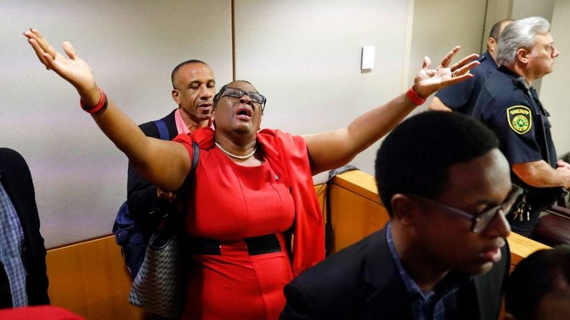 Botham Jean's mother, Allison Jean, rejoices in the courtroom Tuesday, Oct. 1, 2019, after former Dallas police officer Amber Guyger, 31, was found guilty of murder for fatally shooting Botham in his apartment Sept. 6, 2018. T