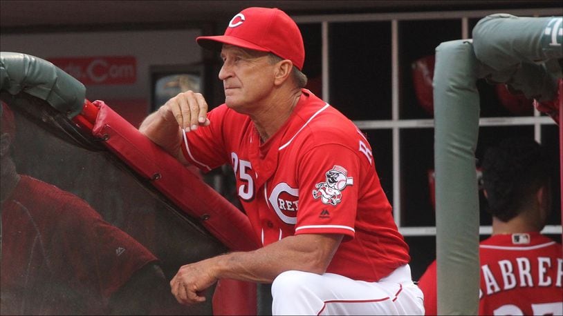 Reds bench coach Jim Riggleman watches from the dugout during a game against the Marlins on Thursday, Aug. 18, 2016, at Great American Ball Park in Cincinnati. David Jablonski/Staff