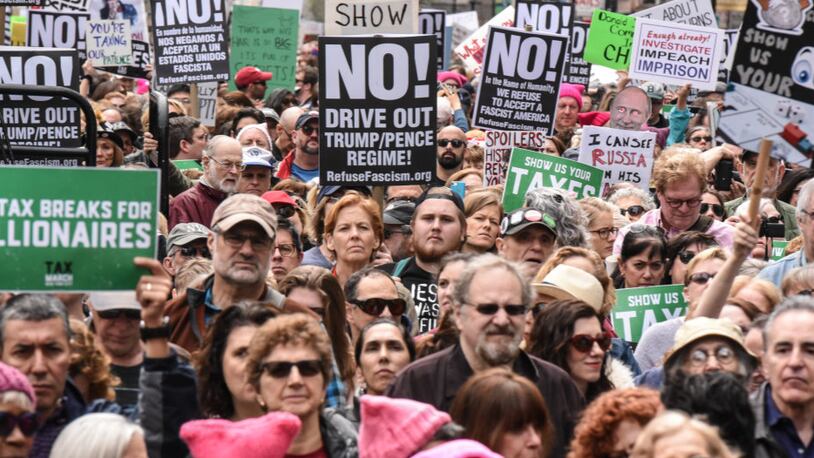 People participate in a Tax Day protest on April 15, 2017 in New York City. Activists in cities across the nation are marching today to call on President Donald Trump to release his tax returns. (Photo by Stephanie Keith/Getty Images)