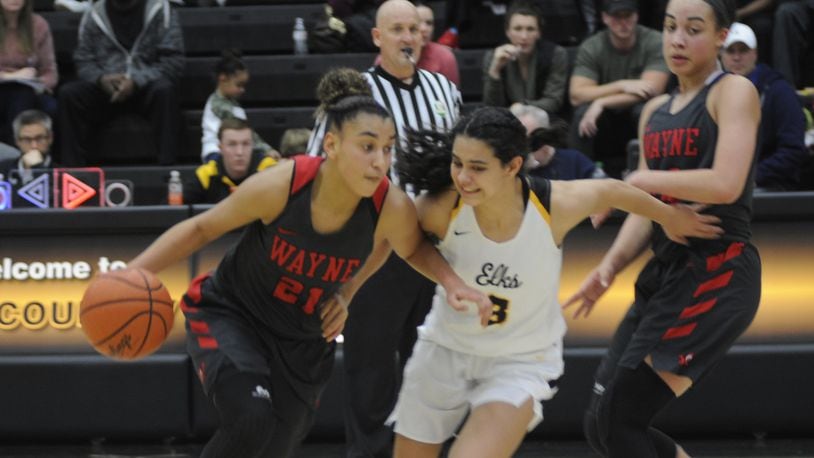 Wayne’s Destiny Bohanon (with ball) is guarded by Centerville’s Amy Velasco. Centerville defeated visiting Wayne 66-60 in a girls high school basketball game on Monday, Dec. 17, 2018. MARC PENDLETON / STAFF