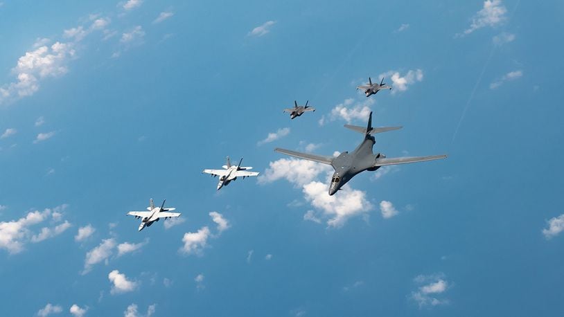 U.S. Navy Carrier Air Wing Five F/A-18 Super Hornets, Marine Corps Marine Fighter Attack Squadron 121 F-35 Lightning IIs, all assigned to Marine Corps Air Station Iwakuni, Japan, and a U.S. Air Force 37th Bomb Squadron B-1B Lancer assigned to Ellsworth Air Force Base, S.D., conduct a large-scale joint and bilateral integration training exercise Aug. 18. (U.S. Air Force photo/Staff Sgt. Peter Reft)