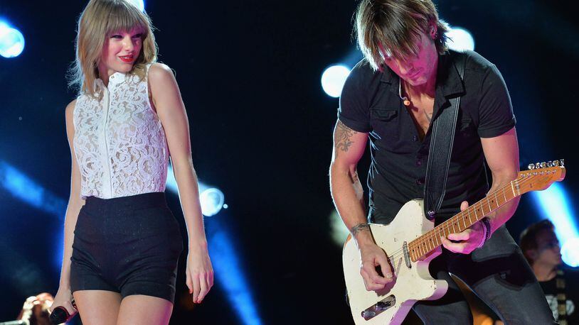 NASHVILLE, TN - JUNE 06:  Taylor Swift and Keith Urban perform during the 2013 CMA Music Festival on June 6, 2013 in Nashville, Tennessee.  (Photo by Rick Diamond/Getty Images)