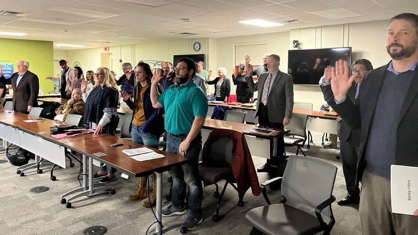 Dozens of people are sworn in to speak at a Dayton Board of Zoning Appeals hearing Tuesday, March 22, 2022. CORNELIUS FROLIK / STAFF