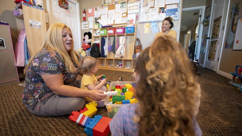Kathy Vinsh, Tyndall Family Child Care provider, left, plays with children in her care in Panama City, Fla., March 21, 2022. (U.S. Air Force photo by Staff Sgt. Magen M. Reeves)