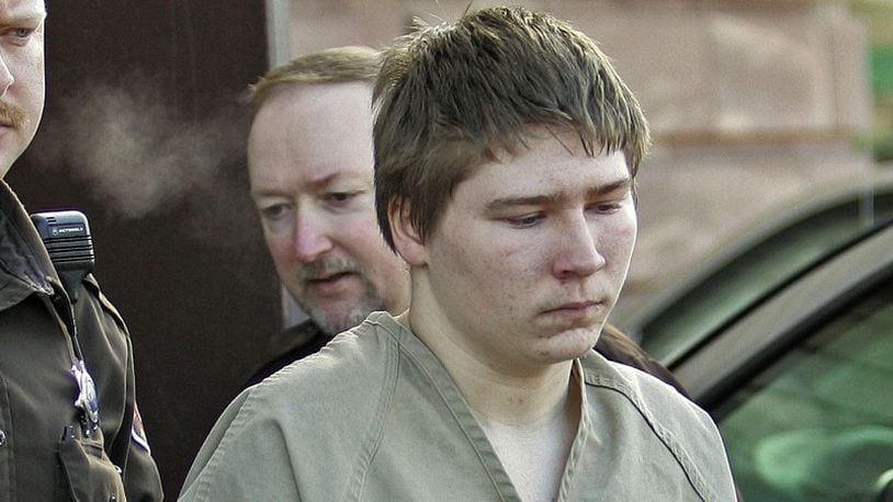 In this Friday, March 3, 2006 photo, Brendan Dassey, 16, is escorted out of a Manitowoc County Circuit courtroom in Manitowoc, Wis. A federal court in Wisconsin on Friday overturned the conviction of Dassey, a man found guilty of helping his uncle kill Teresa Halbach in a case profiled in the Netflix documentary “Making a Murderer.” (AP Photo/Morry Gash, File)