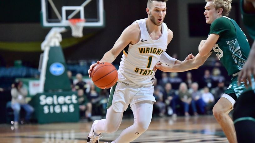 Wright State’s Bill Wampler looks to drive past Green Bay’s Hunter Crist at the Nutter Center on Saturday, Dec. 28, 2019. Joseph Craven/WSU Athletics