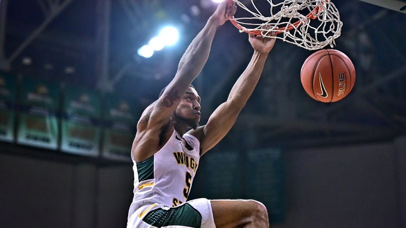 Wright State’s Skyelar Potter dunks home two of his team-high 17 points during a win over Northwestern Ohio last season at the Nutter Center. Joseph Craven/CONTRIBUTED