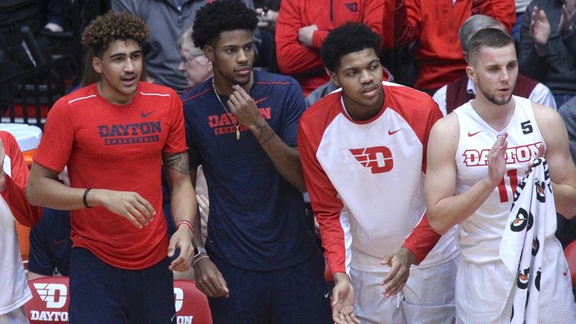 Dayton players (left to right) Obadiah Toppin, Xeyrius Williams, Jordan Pierce and Matej Svoboda cheer from the bench during a game against Tennessee Tech on Wednesday, Dec. 6, 2017, at UD Arena. David Jablonski/Staff