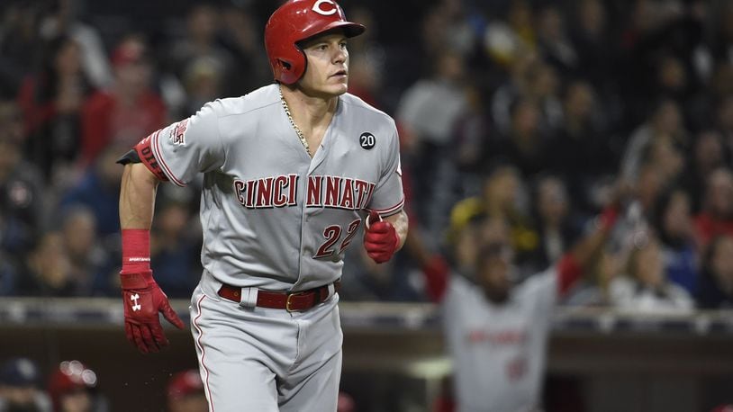 SAN DIEGO, CA - APRIL 19: Derek Dietrich #22 of the Cincinnati Reds watches the flight of his two-run home run during the eleventh inning of a baseball game against the San Diego Padres at Petco Park April 19, 2019 in San Diego, California.  (Photo by Denis Poroy/Getty Images)