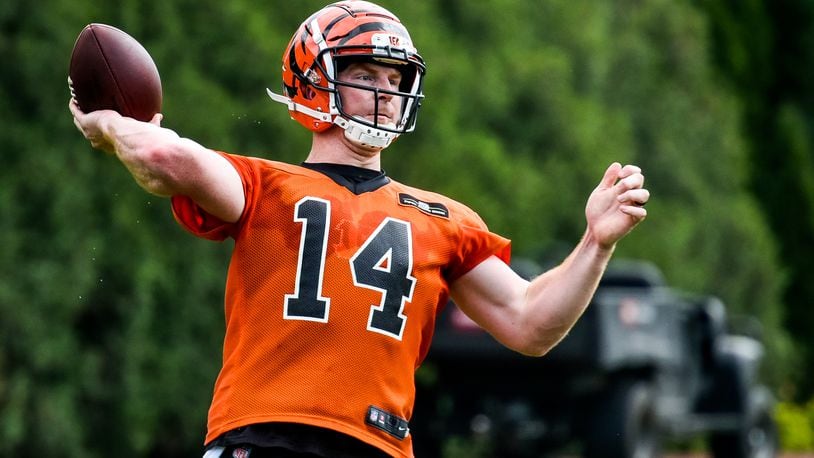 Bengals’ quarterback Andy Dalton makes a pass during organized team activities Tuesday, May 22 at the practice facility near Paul Brown Stadium in Cincinnati. NICK GRAHAM/STAFF