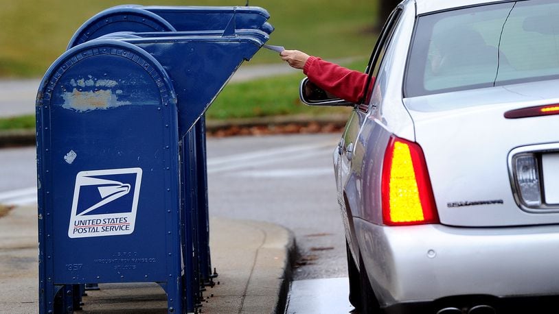 The Beavercreek Police Department is warning residents against using blue mailboxes when mailing items such as cash or checks after receiving reports of thefts from the collections boxes outside U.S. Post Offices. MARSHALL GORBY\STAFF