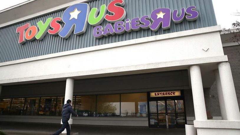 A customer enters a Toys R Us store. The iconic company filed for liquidation in March in a U.S. Bankruptcy court and plans to close 735 stores leaving 33,000 workers without employment.